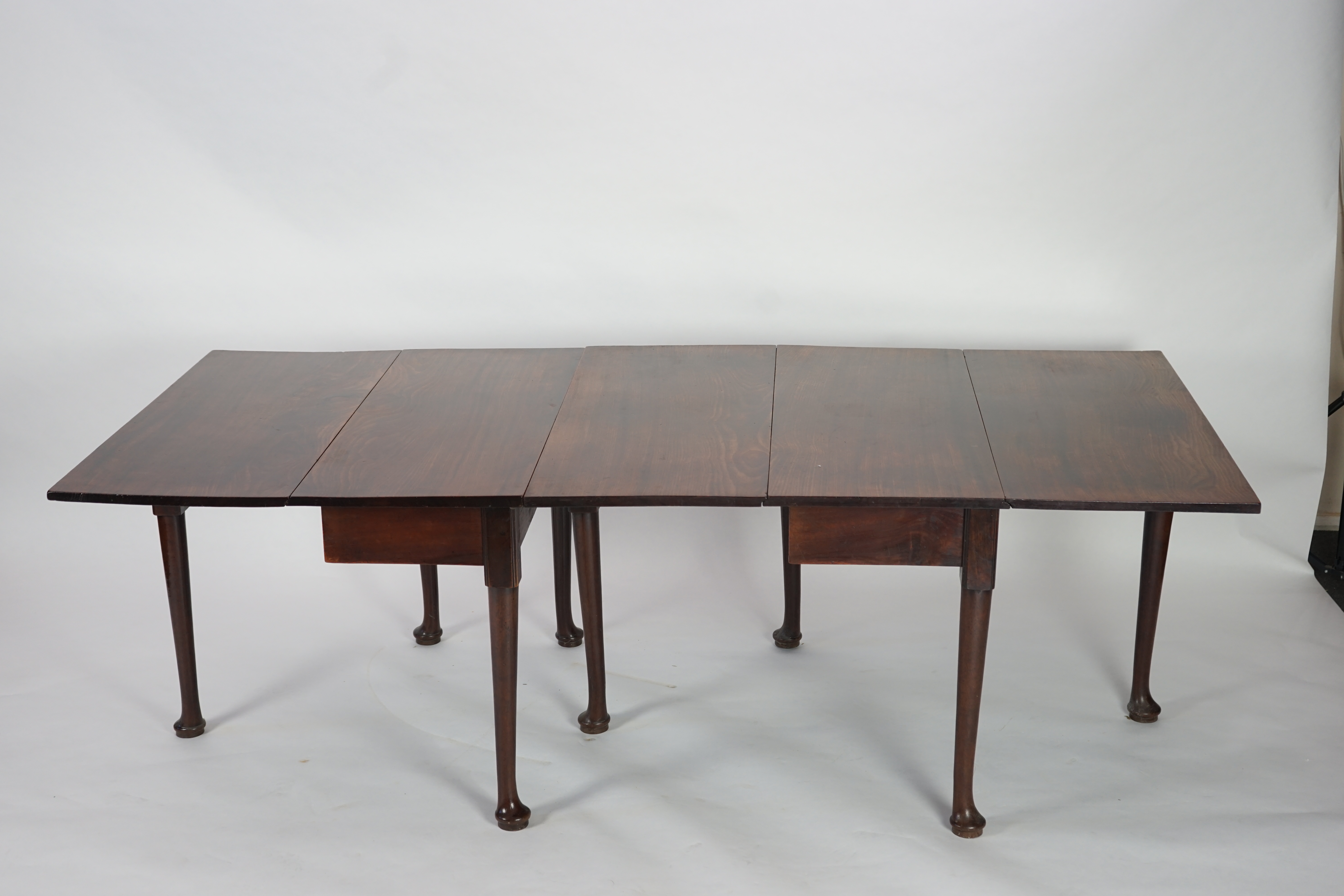 A George II mahogany double drop leaf dining table
